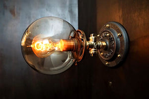 Industrial brass edison bulb wall sconce with glass smoke shade