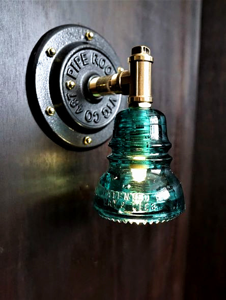 Industrial brass glass insulator wall sconce